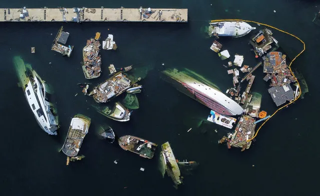 A view of debris and damaged boats a month after Hurricane Otis hit Acapulco, Mexico on November 25, 2023. (Photo by Raquel Cunha/Reuters)