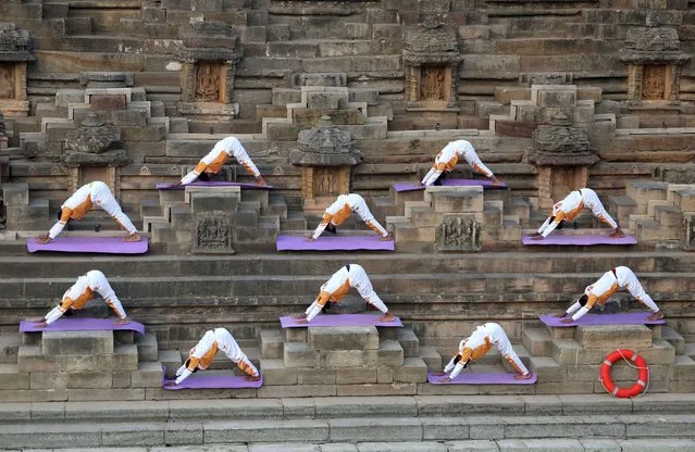  Participants perform a “Surya Namaskar” or sun salutation to welcome the new year at the Sun Temple in Modhera village near Ahmedabad, India on January 1, 2024. (Photo by Amit Dave/Reuters)