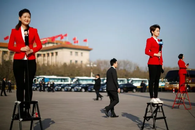 Journalists report outside the Great Hall of the People during the opening session in Beijing, China on March 5, 2019. (Photo by Aly Song/Reuters)