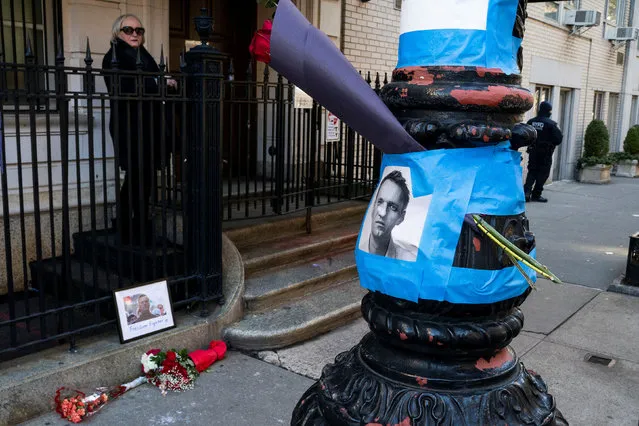 Images and flowers for the opposition leader Alexei Navalny are placed outside of the Russian consulate in New York City, U.S., February 19, 2024. (Photo by Eduardo Munoz/Reuters)