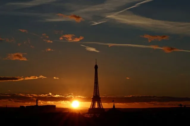 View of the Eiffel tower as the sun sets on a winter day in Paris, France on January 15, 2024. (Photo by Stephanie Lecocq/Reuters)
