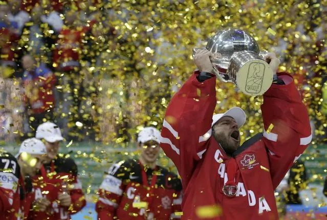 Canada's goaltender Mike Smith holds the trophy during the victory ceremony of the Ice Hockey World Championship final game at the O2 arena in Prague, Czech Republic May 17, 2015. (Photo by David W. Cerny/Reuters)