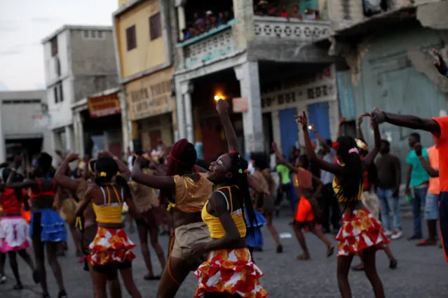 Revellers dance as they parade along a street at the Carnival of Port-au-Prince, Haiti, February 27, 2017. (Photo by Andres Martinez Casares/Reuters)