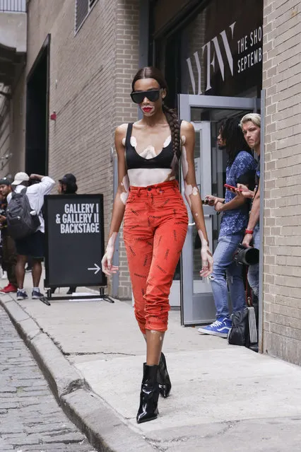 Winnie Harlow is seen in a black top, red pants and black shows on the street during New York Fashion Week  on September 7, 2018 in New York City. (Photo by Achim Aaron Harding/Getty Images)