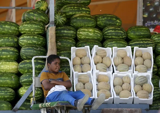 A Saudi boy sells melons and watermelons in Riyadh, Saudi Arabia, April 25, 2016. (Photo by Faisal Al Nasser/Reuters)
