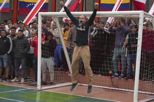 An inmate playing the goalkeeper position celebrates his team's goal during a soccer match as part of an intramural tournament at the Sarita Colonia prison in Callao, Peru, June 18, 2024. (Photo by Guadalupe Pardo/AP Photo)