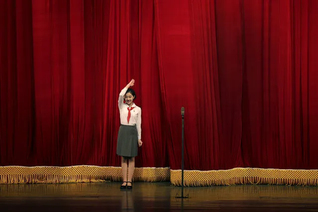 A North Korean student salutes the audience at the start of a performance at the Mangyongdae Children's Palace on Friday, April 14, 2017, in Pyongyang, North Korea. (Photo by Wong Maye-E/AP Photo)