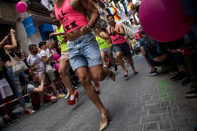 Contestants take part in the annual race on high heels during World Pride celebrations in the quarter of Chueca in Madrid, Spain, June 29, 2017. (Photo by Juan Medina/Reuters)