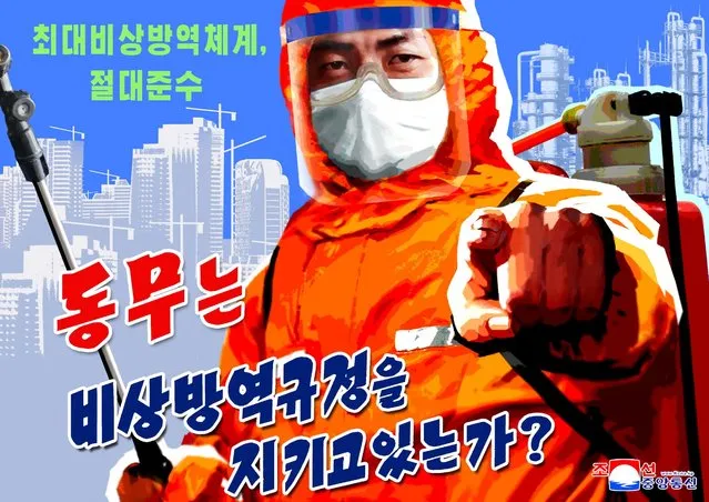 A poster depicts a disinfection worker in North Korea on May 23, 2022. The COVID outbreak in the isolated country, confirmed about two weeks ago, has stoked concerns about a lack of vaccines and medical supplies, while experts said a nationwide lockdown could deepen a food crisis in the country of 25 million. (Photo by KCNA via Reuters)