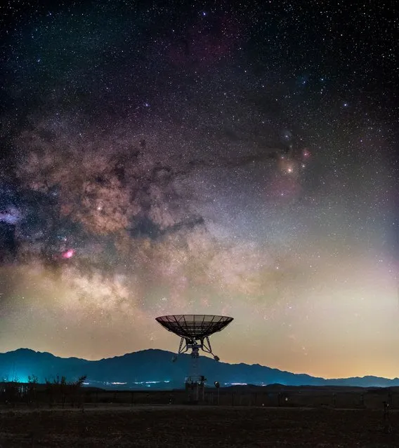 “A Battle We Are Losing”, Haitong Yu (China). The Milky Way rises above a small radio telescope from a large array at Miyun Station, National Astronomical Observatory of China, in the suburbs of Beijing. The image depicts the ever-growing light pollution we now experience, which together with electromagnetic noise has turned many optical and radio observatories near cities both blind and deaf – a battle that inspired the photographer’s title for the shot. The image used a light pollution filter (iOptron L-Pro) and multiple frame stacking to get the most of the Milky Way out of the city light. (Photo by Haitong Yu/National Maritime Museum/The Guardian)