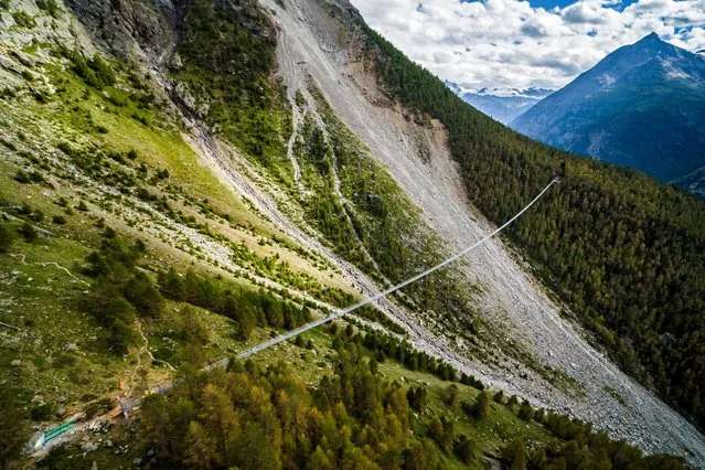 A picture taken with a drone shows a general aerial view on the “Europabruecke” bridge, the world's longest pedestrian suspension bridge with a length of 494m, prior its the official inauguration of the construction in Randa, Switzerland, 28 July 2017 (issued 29 July 2017). (Photo by Valentin Flauraud/EPA)