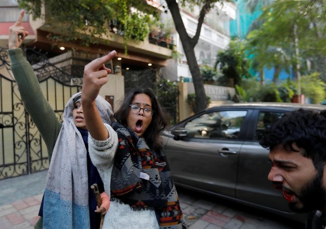 Demonstrators flip the bird during a protest against a new citizenship law, in New Delhi, India, December 15, 2019. (Photo by Adnan Abidi/Reuters)