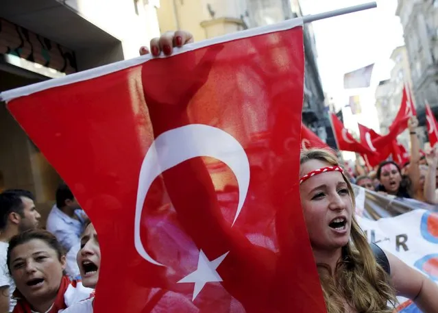 Demonstrators wave Turkish flags as they shout nationalist slogans during a protest against Kurdistan Workers' Party (PKK) in central Istanbul, Turkey, August 16, 2015. (Photo by Murad Sezer/Reuters)