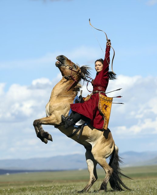 A horsewoman riding and archery nomadic culture festival in the Nalaikh District of Ulan Bator, Mongolia on August 19, 2023. A cultural festival to promote Mongolia's nomadic intangible culture and the development of the tourism sector was held from Aug. 18 to 20 in the Nalaikh District of Ulan Bator. Horses play an irreplaceable role in the lives of Mongolian people. Long-term practice of production and living have brought up Mongolians the tradition of respecting horses, and formed the rich horse culture of Mongolian people. (Photo by Xinhua News Agency/Rex Features/Shutterstock)