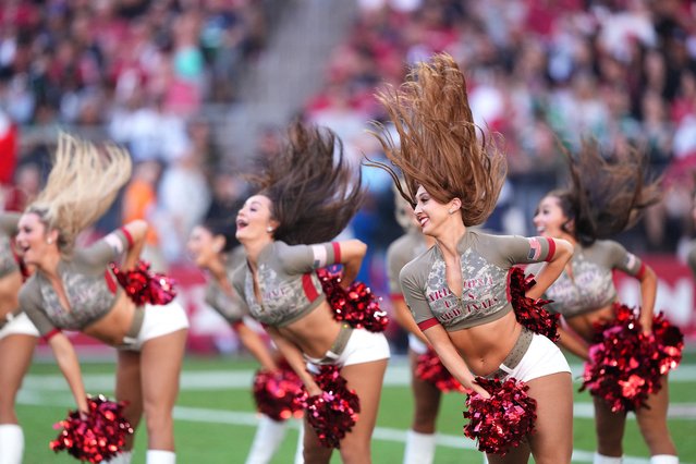 The cheerleaders for NFL’s Arizona Cardinals warm up fans at a game against the New York Jets in Glendale, Arizona on November 10, 2024. (Photo by Joe Camporeale/Reuters)