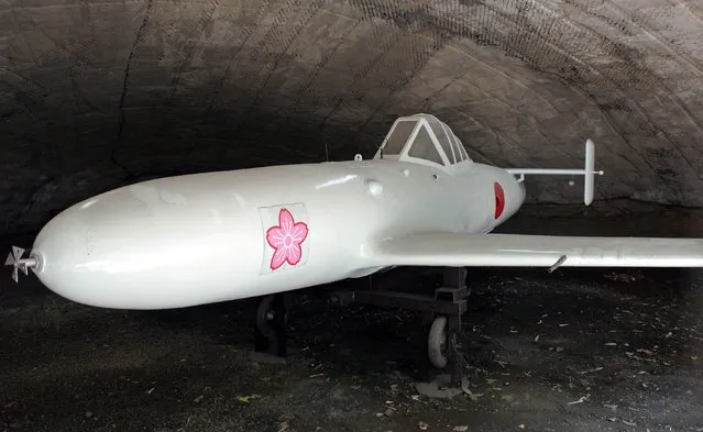 This photo taken on August 8, 2014 shows a replica of a rocket-powered kamikaze attack plane “Oka”, (“Cherry Blossom”), displayed at a park beside the former Imperial Navy air base in Kashima, Ibaraki prefecture, where Oka pilots trained. (Photo by Toshifumi Kitamura/AFP Photo)