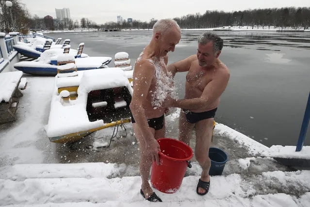 Participants in the Winter Fun family cold training festival in Minsk, Belarus on December 30, 2019. (Photo by Natalia Fedosenko/TASS)