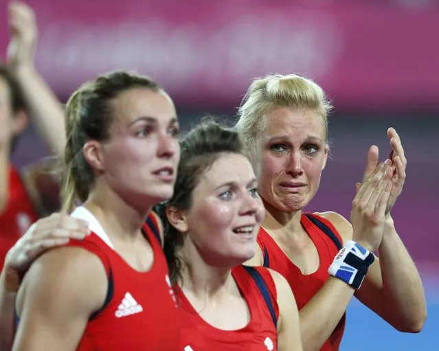 Great Britain's players react after defeated by Argetina at their women's semifinal hockey match at the Riverbank Arena at the London 2012 Olympic Games August 8, 2012. (Photo by Suzanne Plunkett/Reuters)