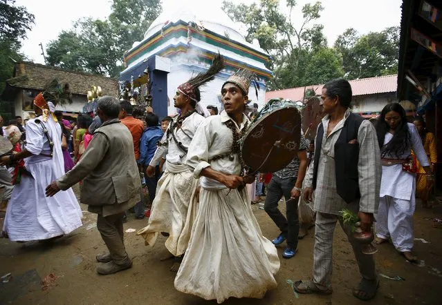 Shamans perform religious rituals during the “Janai Purnima” festival (Sacred Thread Festival) at Timal Village in Kavre, Nepal, August 29, 2015. (Photo by Navesh Chitrakar/Reuters)