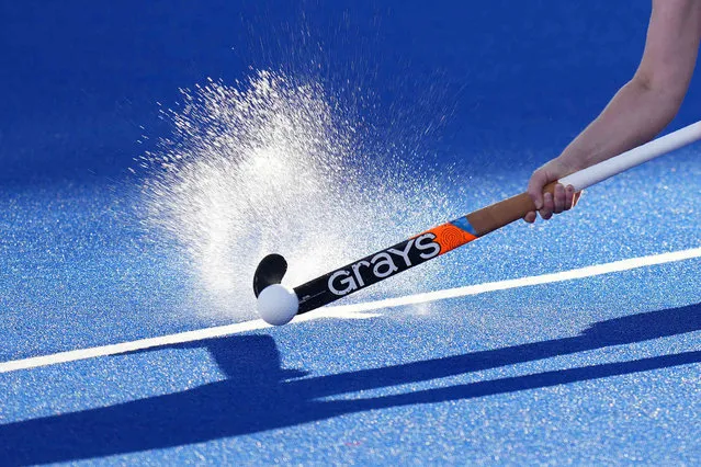 England's Laura Unsworth passes the ball to her teammate during the women's semifinal hockey match between England and New Zealand at the Commonwealth Games in Birmingham, England, Friday, August 5, 2022. (Photo by Aijaz Rahi/AP Photo)