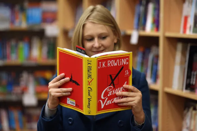 A woman at Foyles bookshop looks at a copy of J. K. Rowling's latest novel 'The Casual Vacancy' which has gone on sale today starting at 8:00 am on September 27, 2012 in London, England.  'The Casual Vacancy' is J. K. Rowling's first book aimed at an adult readership and is centered on a parish council election in a small West Country town.  (Photo by Oli Scarff)