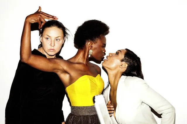 From left: Ann Kleinhenz, Shingai Shoniwa, and Rosario Dawson pose in a photo booth at a party thrown by Calvin Klein during New York Fashion Week, September 8, 2014. (Photo by Amy Lombard/The New York Times)