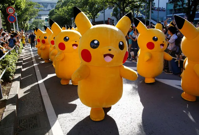 Performers wearing Pokemon's character Pikachu take part in a parade in Yokohama, Japan, August 7, 2016. (Photo by Kim Kyung-Hoon/Reuters)