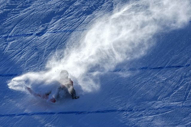 Xiong Shirui of China crashes during the Women's Snowboard Big Air at the 9th Asian Winter Games in Yabuli in northeast China's Heilongjiang province on Monday, February 10, 2025. (Photo by Andy Wong/AP Photo)