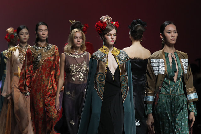 Models parade the latest creations by Uighur designer Dilara Zakir on stage during China Fashion Week in Beijing, Monday, October 30, 2017. (Photo by Andy Wong/AP Photo)