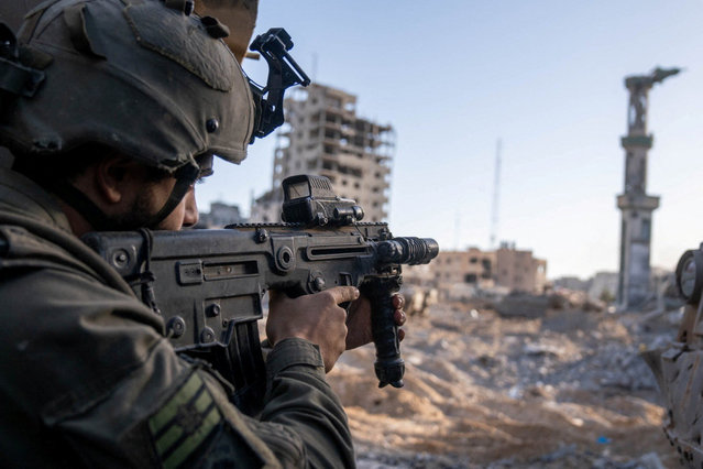 An Israeli soldier operates in the Gaza Strip in this  picture released December 30, 2023. (Photo by Israel Defense Forces via Reuters)