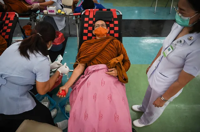 Buddhist monks donate blood for the victims on October 07, 2022 in Nong Bua Lamphu, Thailand. Local media reports said that former police officer Panya Kamrab, 34, had killed at least 37 people, including 24 children – some as young as 2 – in a mass shooting and stabbing at a child care center in northeast Thailand. The assailant subsequently shot himself and his family, police said. The shooting comes two years after a disgruntled soldier killed 29 people in a shooting at a mall in 2020. (Photo by Sirachai Arunrugstichai/Getty Images)
