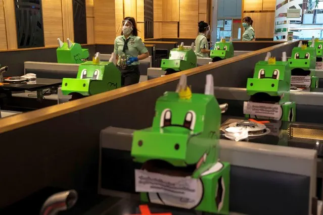 Barbegon, mascots of the “Bar.B.Q Plaza” restaurant occupy the seats as part of social distancing measures to prevent the spread of the coronavirus disease (COVID-19), at the restaurant reopened after the easing of restrictions, in Bangkok, Thailand, May 17, 2020. (Photo by Athit Perawongmetha/Reuters)