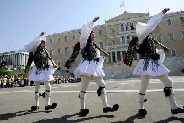 Members of the Greek Presidential Guard march during a ceremonial parade in front of the parliament building in Athens, Greece, September 20, 2015. Alexis Tsipras, the firebrand Greek leftist who lost his bitter fight with Europe's establishment to end its harsh economic austerity against his country, seeks re-election on Sunday a month after he resigned as prime minister. (Photo by Michalis Karagiannis/Reuters)