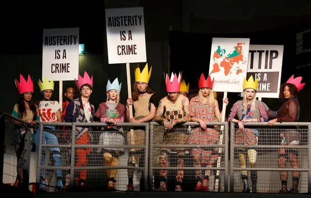 Protesters on the runway at the Vivienne Westwood Red Label show during London Fashion Week Spring/Summer 2016, September 20, 2015 in London. (Photo by Tristan FewingsGetty Images)