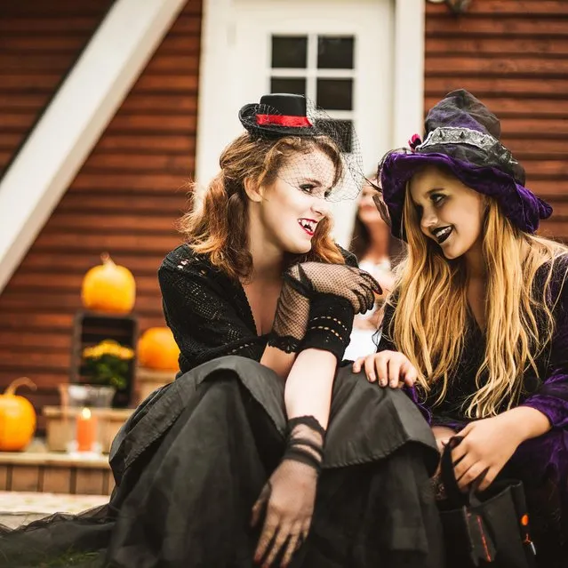 Young vampire and witch dressed up for Halloween. (Photo by Knape/Getty Images)