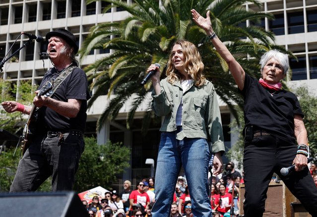 (L to R) Neil Young, Maggie Rogers and Joan Baez perform during the “Fighting Oligarchy” tour at Grand Park on April 12, 2025 in Los Angeles, California. An estimated 36,000 people attended the rally whereU.S. Sen. Bernie Sanders (I-VT) and Rep. Alexandria Ocasio-Cortez (D-NY) spoke. (Photo by Mario Tama/Getty Images)