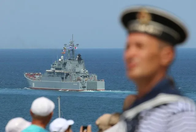 The Russian Navy's large landing ship Caesar Kunikov sails during the Navy Day parade in the Black Sea port of Sevastopol, Crimea on July 26, 2020. (Photo by Alexey Pavlishak/Reuters)
