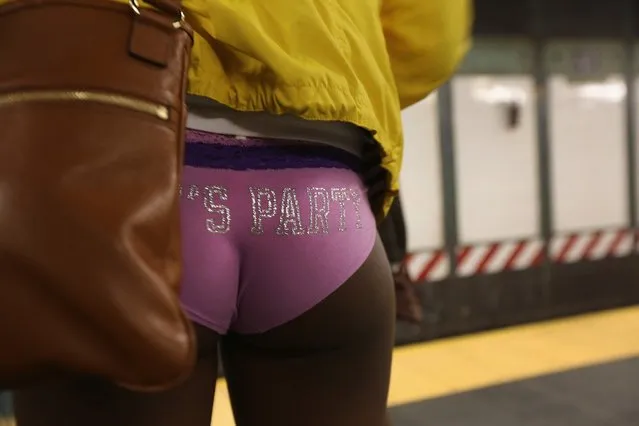 NEW YORK, NY - JANUARY 13:  A pantless woman stands on a subway platform on January 13, 2013 in New York City. Thousands of people participated in the 12th annual No Pants Subway Ride, organized by New York City prank collective Improv Everywhere. During the afternoon winter event, participants boarded separate subway stops and removed their pants, pretending that they did not know each other. The event, refered to as a "celebration of silliness" is designed to make fellow subway riders laugh and smile.  (Photo by John Moore/Getty Images)