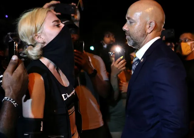 Demonstrators confront U.S. Rep. Brian Mast during a protest in Washington, U.S. August 27, 2020. (Photo by Leah Millis/Reuters)