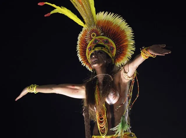 A reveller from Imperatriz Leopoldinense samba school participates during the annual carnival parade in Rio de Janeiro's Sambadrome, February 12, 2013. (Photo by Ricardo Moraes/Reuters)