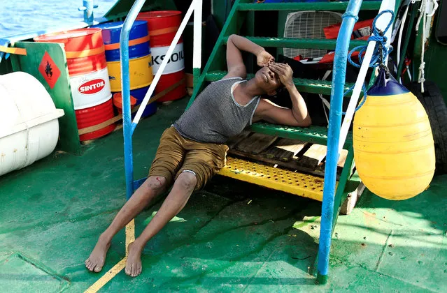 An exhausted migrant is seen onboard of Iuventa vessel after she was rescued from an overcrowded dinghy by members of the German NGO Jugend Rettet, during a rescue operation, off the Libyan coast in the Mediterranean Sea September 21, 2016. (Photo by Zohra Bensemra/Reuters)