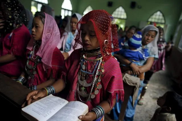 An ethnic Kayaw attend a mass at the catholic church at Htaykho village in the Kayah state, Myanmar September 13, 2015. (Photo by Soe Zeya Tun/Reuters)