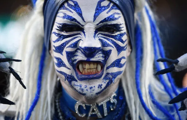 A fan waits for the start of the AFL match between the Geelong Cats and the Sydney Swans in Melbourne, Australia on September 22, 2016. (Photo by Tracey Nearmy/AAP)