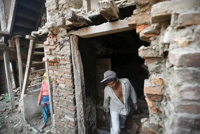 Family members work to rebuild their house a year after the 2015 earthquakes in Bhaktapur, Nepal, April 25, 2016. (Photo by Navesh Chitrakar/Reuters)