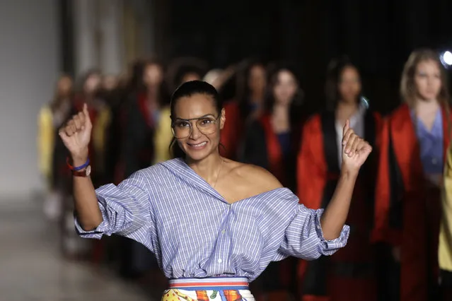 Designer Stella Jean accepts applause at the end of her womens Spring/Summer 2018/19 fashion collection, presented in Milan, Italy, on September 24, 2017. Stella Jean, the only Black designer belonging to Italy’s fashion council is withdrawing from this month’s Milan Fashion Week citing a lack of commitment to diversity and inclusion, and on Wednesday Feb. 8, 2023 announced a hunger strike out of concern that other minority designers associated with her will suffer a backlash. (Photo by Luca Bruno/AP Photo)
