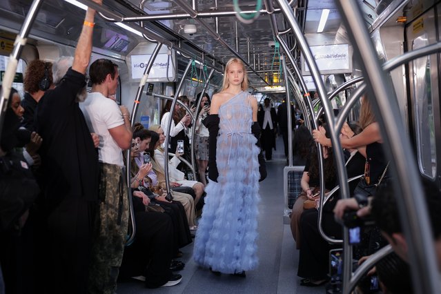 A model wears a creation from the Gloria Coelho collection during a Sao Paulo Fashion Week event at the Julio Prestes train station in Sao Paulo, Monday, October 13, 2025. (Photo by Ettore Chiereguini/AP Photo)