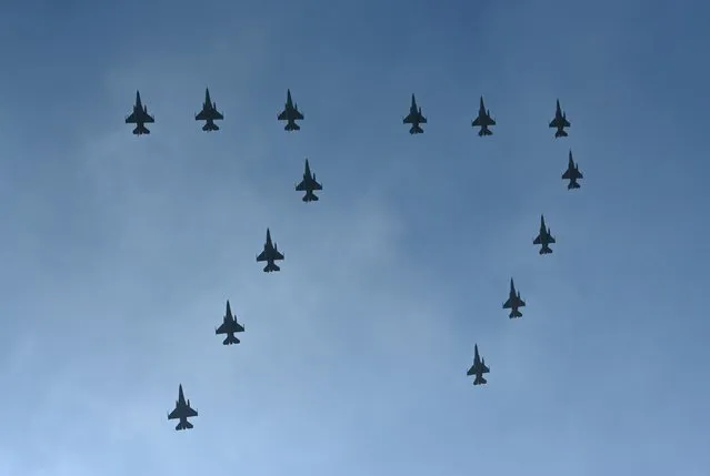 Indonesia's F-16 Fighting Falcon fly in formation to mark the 77th anniversary of the Indonesian Air Force at the Halim Perdanakusuma airport in Jakarta on April 9, 2023. (Photo by Adek Berry/AFP Photo)