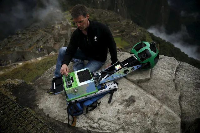Daniel Filip, Tech Lead Manager for Google Maps, shows parts of the Trekker, a 15-camera device, while mapping the Inca citadel of Machu Picchu for Google Street View in Cuzco, Peru, August 11, 2015. (Photo by Pilar Olivares/Reuters)