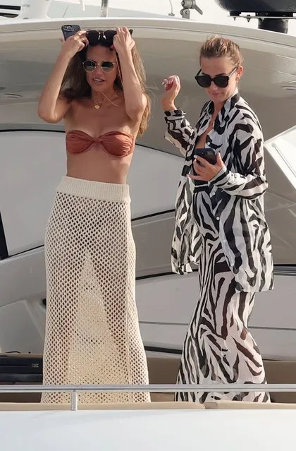 Reality TV star Mark Wright (not pictured), and Corrie actress wife Michelle Keegan (L) enjoy a fun afternoon on a yacht in Spain in the second decade of June 2023. The couple joined a large group of friends as they set sail on the Mediterranean Sea. The couple, who are both fitness fanatics, appeared to let loose and unwind as they both held a glass of wine as they partied with their pals. (Photo by GTres/Splash News and Pictures)