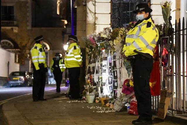 Police officers patrol outside the Myanmar Embassy in London, Wednesday, April 7, 2021. Newspaper reports say the embassy was taken over by members of the country's new military regime Wednesday evening. (Photo by Alberto Pezzali/AP Photo)